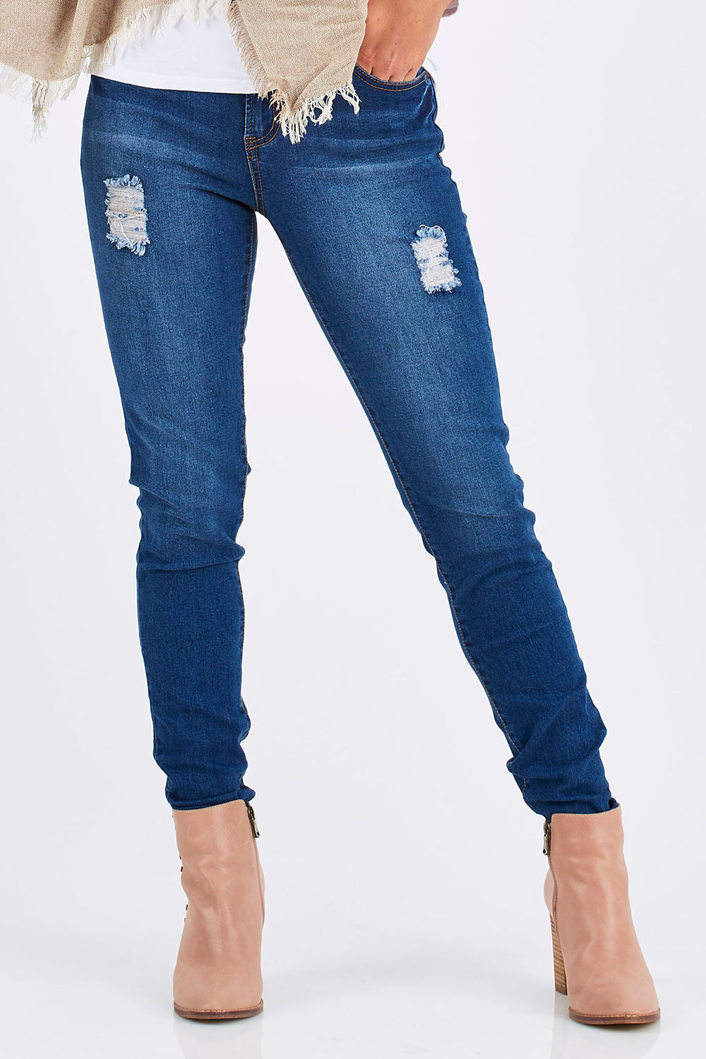 Model Chesska wearing size 10 of the Nova Skinny in colour Denim (Blue), from the front, cropped image