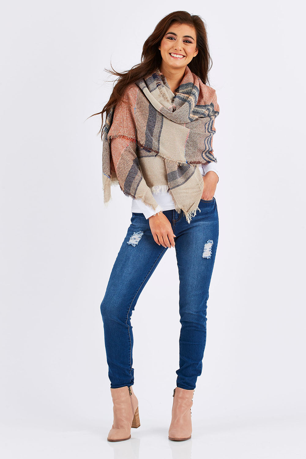 Model Chesska wearing size 10 of the Nova Skinny in colour Denim (Blue), from the front, showing the whole outfit