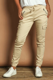 Model Katie wearing size 10 of the Harlow Cargo Jogger in colour Beige, from the front, cropped image
