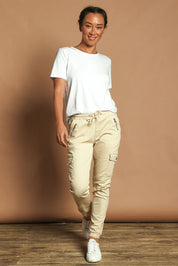 Model Katie wearing size 10 of the Harlow Cargo Jogger in colour Beige, from the front, showing the whole outfit