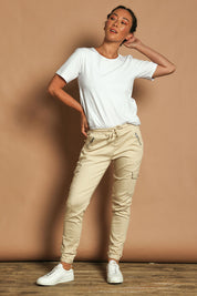 Model Katie wearing size 10 of the Harlow Cargo Jogger in colour Beige, from the front, showing the whole outfit