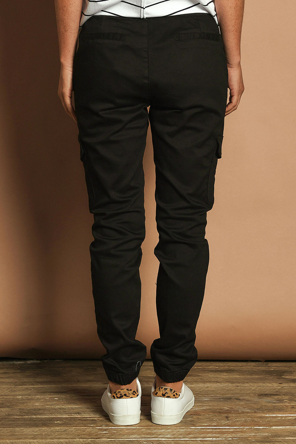 Model Katie wearing size 10 of the Harlow Cargo Jogger in colour Black (Black), from the back