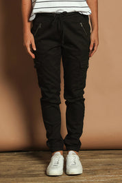 Model Katie wearing size 10 of the Harlow Cargo Jogger in colour Black (Black), from the front, cropped image