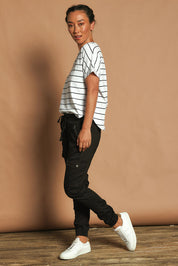 Model Katie wearing size 10 of the Harlow Cargo Jogger in colour Black (Black), from the front, showing the whole outfit