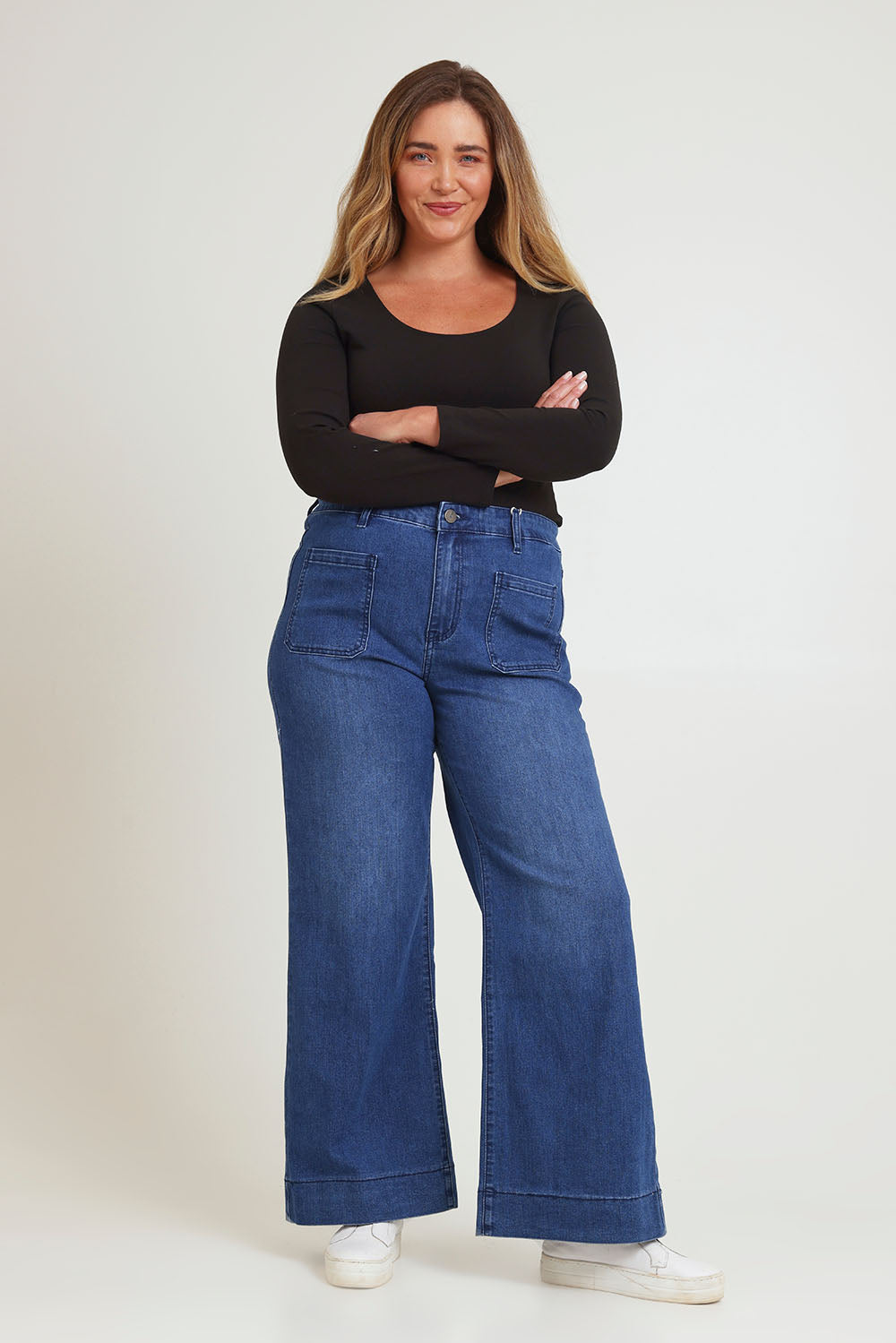 Model Chanel wearing size 16 of the Katie Highin colourWaisted Front Pocket Wide Leg Jean - Darkdenim (Blue), from the front, showing the whole outfit