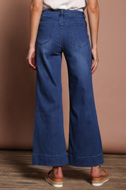 Model Madeline wearing size 9 of the Katie Highin colourWaisted Front Pocket Wide Leg Jean - Darkdenim (Blue), from the back