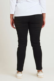 Model Chanel wearing size 16 of the River Ribbed Pull On Jean in colour Black (Black), from the back
