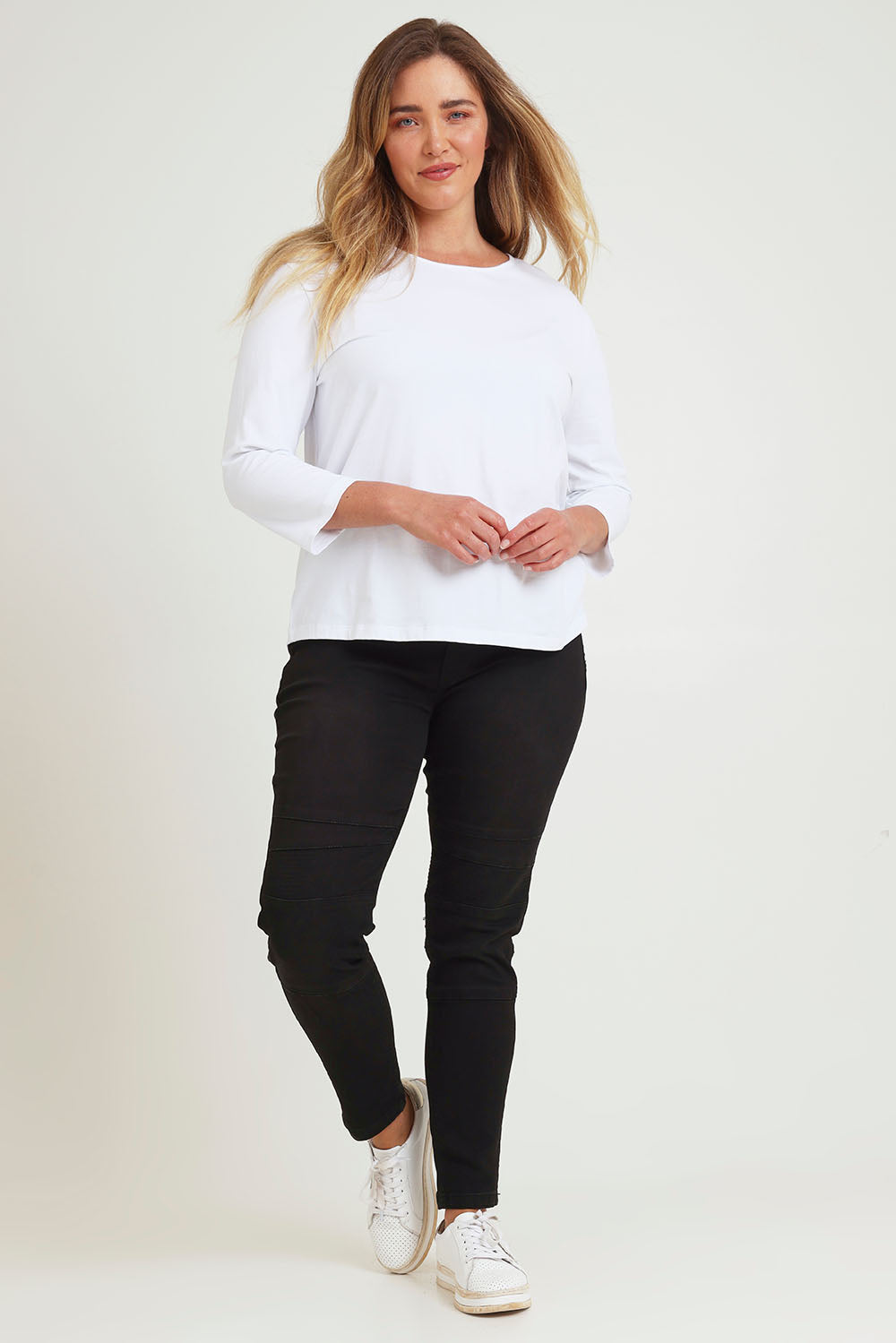 Model Chanel wearing size 16 of the River Ribbed Pull On Jean in colour Black (Black), from the front, showing the whole outfit