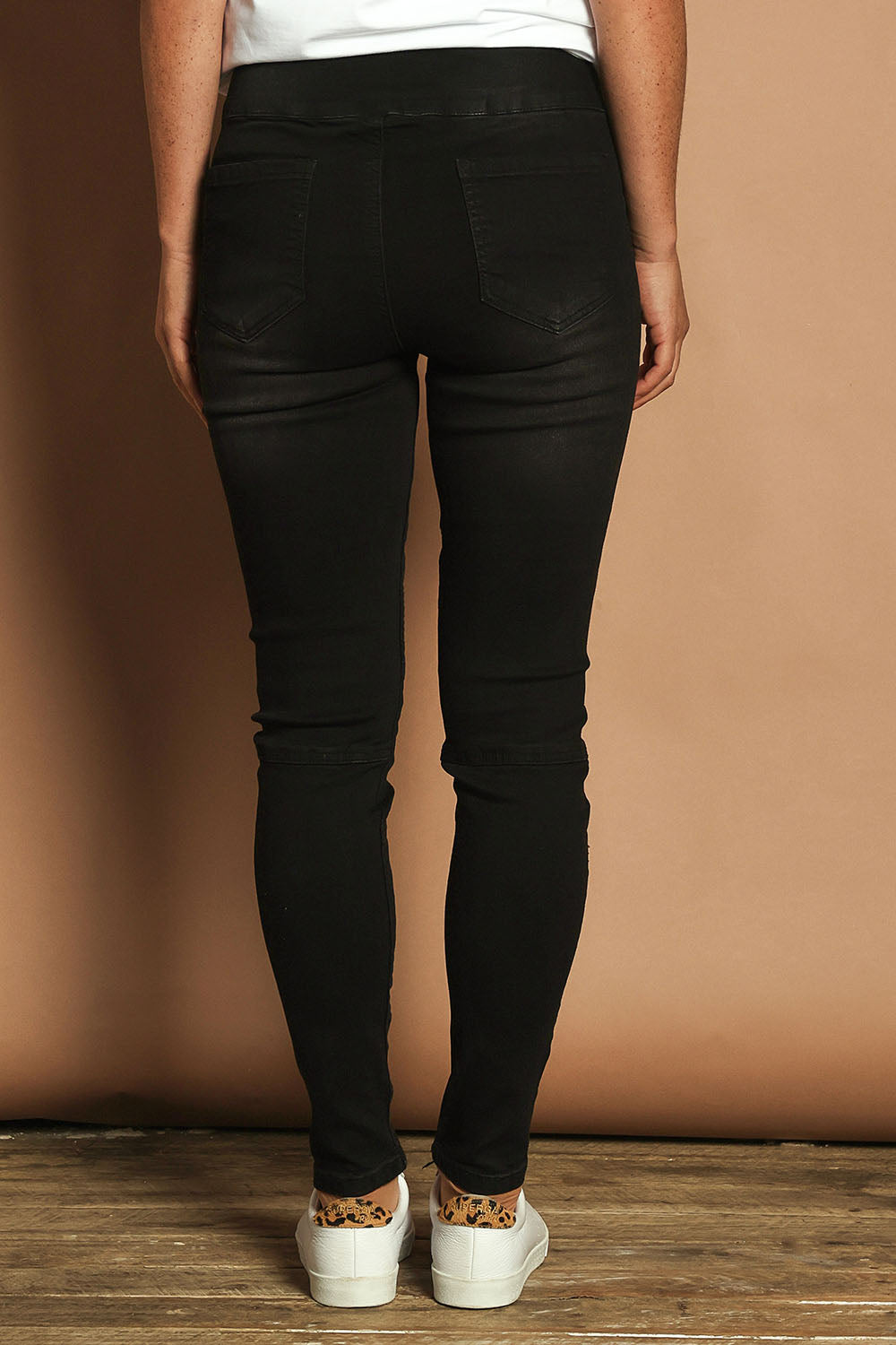 Model Katie wearing size 10 of the River Ribbed Pull On Jean in colour Black (Black), from the back