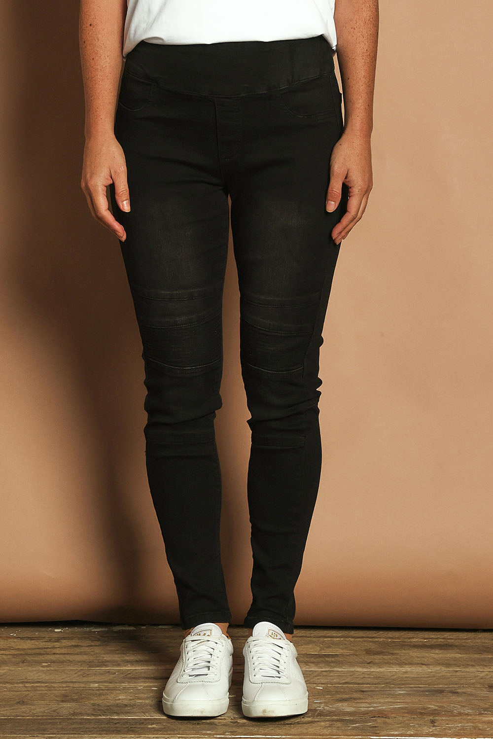 Model Katie wearing size 10 of the River Ribbed Pull On Jean in colour Black (Black), from the front, cropped image