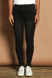 Model Katie wearing size 10 of the River Ribbed Pull On Jean in colour Black (Black), from the front, cropped image