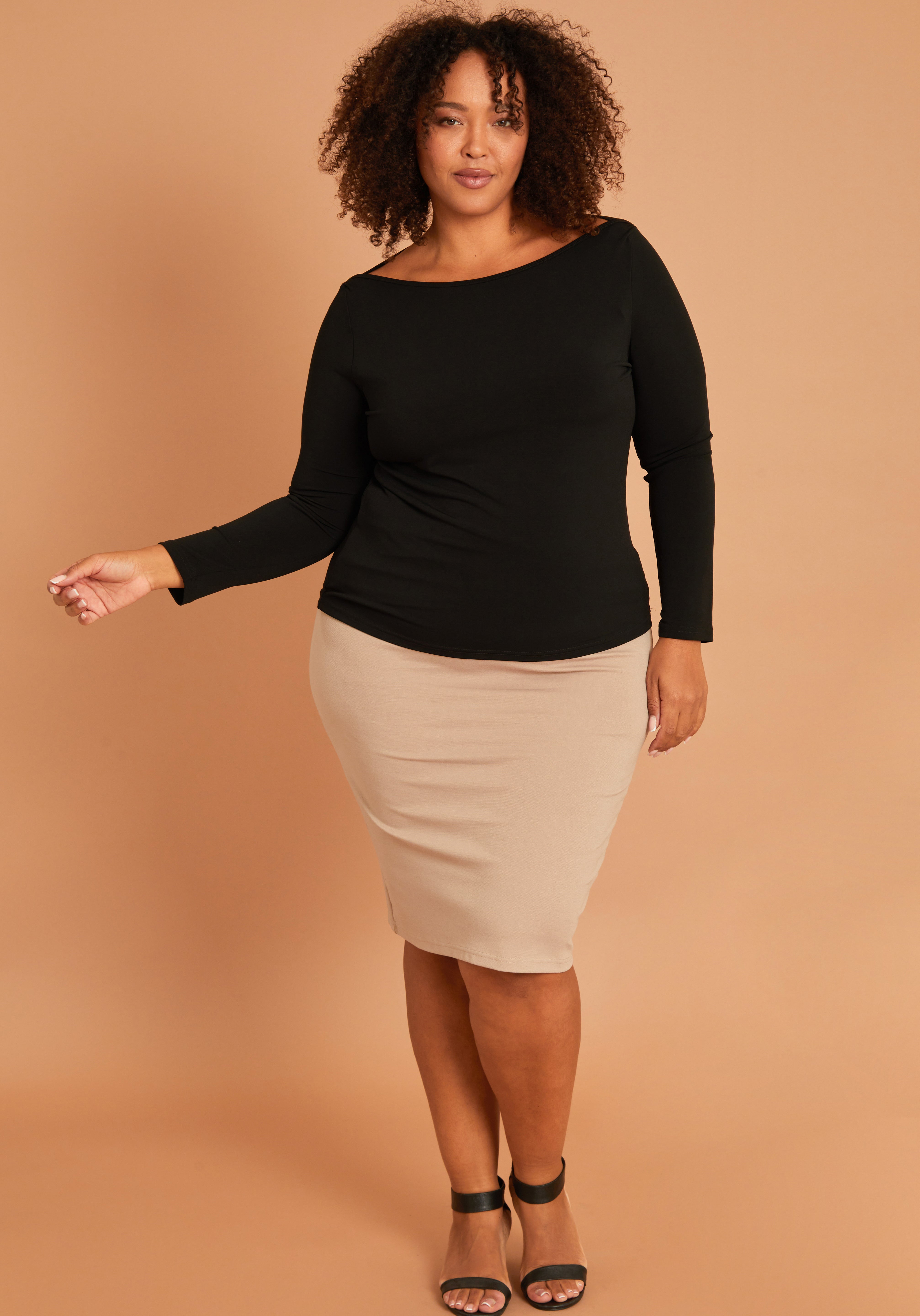 Model Alexis wearing size 16 of The Ponte Knee Length Pencil Skirt in colour Beige, from the front, showing the whole outfit