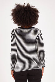 Model Olivia wearing size S of the Long Sleeve Cardigan in colour Blkwhite (Black), from the back