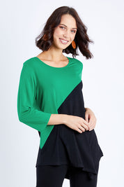 Model Andrea wearing size S of the 3/4 Sleeve Two Tone Bamboo Tunic in colour Blackemrld (Black), from the front, cropped image