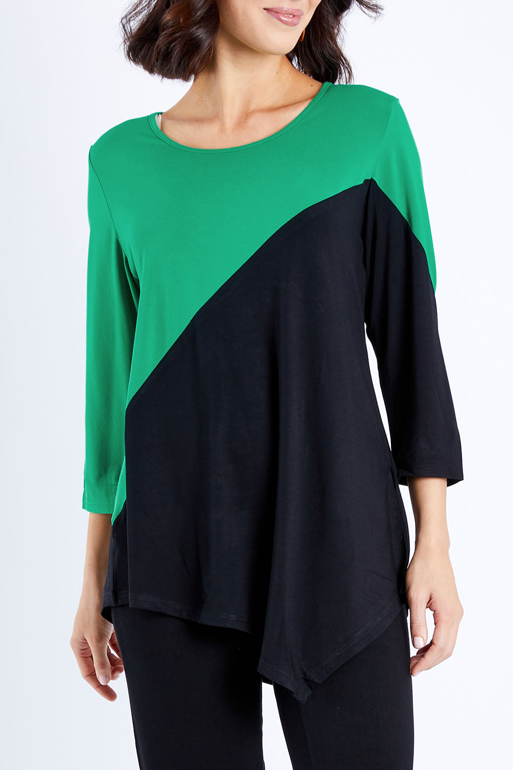 Model Andrea wearing size S of the 3/4 Sleeve Two Tone Bamboo Tunic in colour Blackemrld (Black), from the front, cropped image