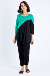 Model Andrea wearing size S of the 3/4 Sleeve Two Tone Bamboo Tunic in colour Blackemrld (Black), from the front, showing the whole outfit