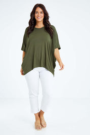 Model Laura wearing size OneSize of the Vin colourNeck Bamboo Drape Top - Olive (Green), from the front, showing the whole outfit