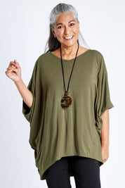 Model Nadine wearing size OneSize of the Vin colourNeck Bamboo Drape Top - Olive (Green), from the front, cropped image