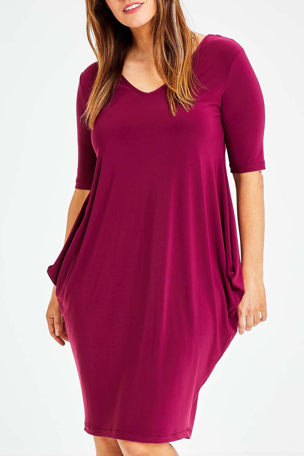 Model Laura wearing size 14 of the Preloved Flowing V Neck Dress in colour Purple (Purple), from the front, cropped image
