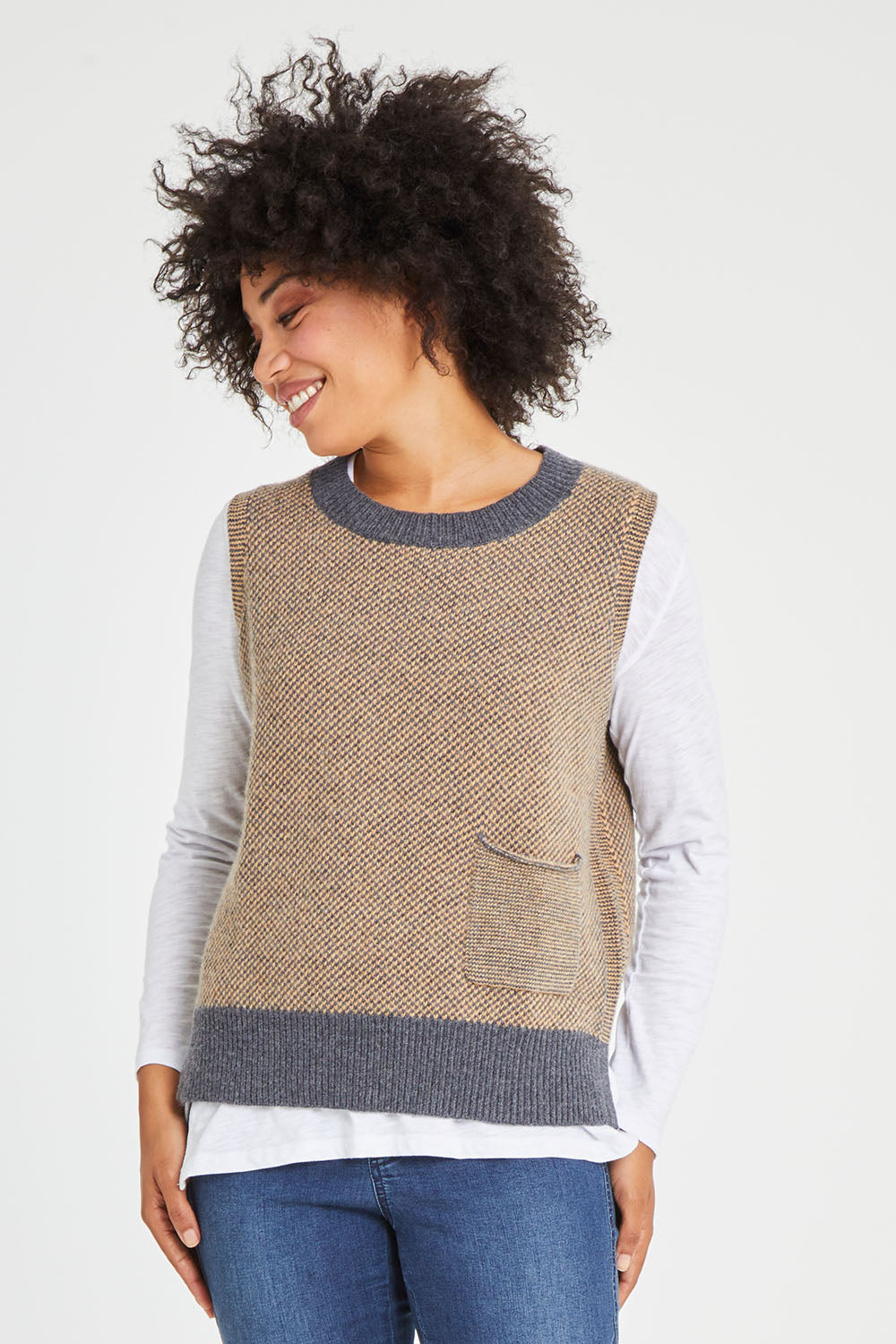 Model Olivia wearing size S of the Birdseye Vest in colour Charcoal, from the front, cropped image