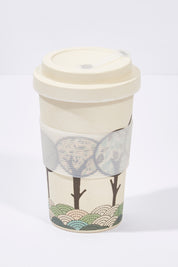 A model wearing size OneSize of the Bamboo Printed Ecup Coffee Cup in colour RoundTree, from the front, showing the whole outfit