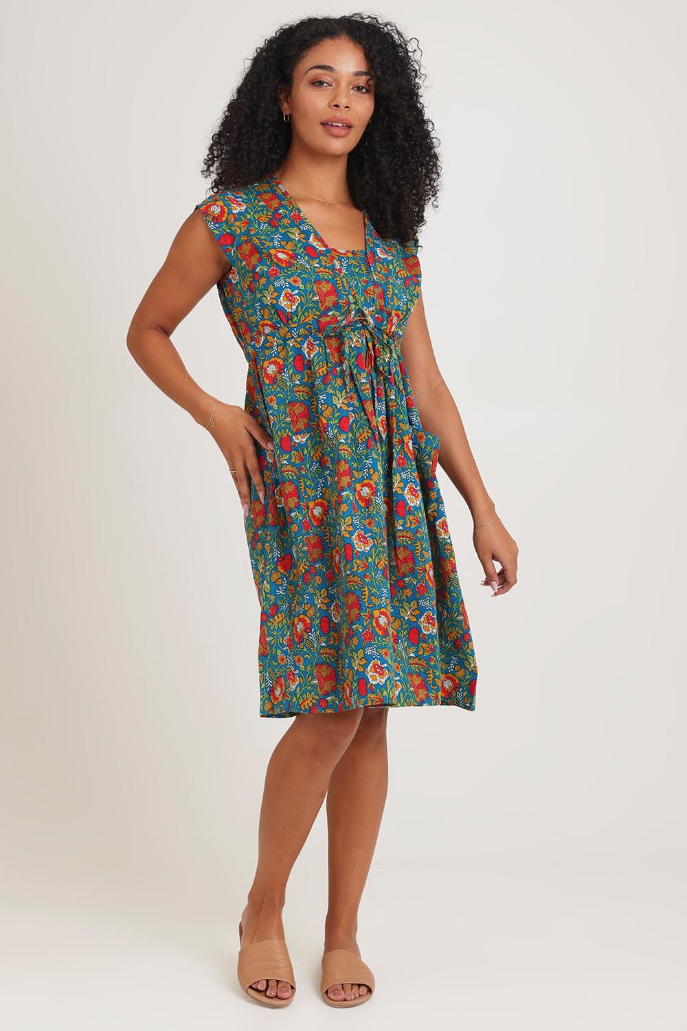 Model Ziara wearing size S of the Chrissie Cotton Tunic Dress in colour Valla, from the front, showing the whole outfit