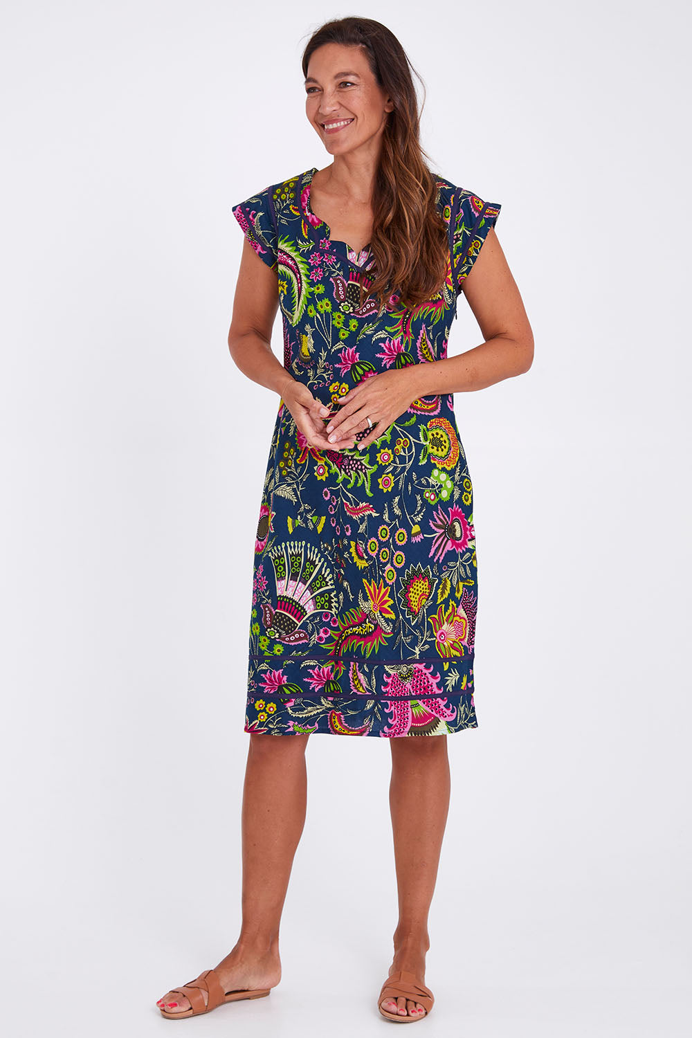 Model Alex wearing size S of the Cassy Dress in colour Irisprint (Blue), from the front, showing the whole outfit