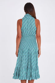 Model Alex wearing the Polly Dress in colour Emmaprint (Blue), from the back