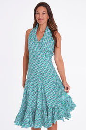Model Alex wearing the Polly Dress in colour Emmaprint (Blue), from the front, cropped image