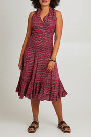 Model Olivia wearing size S-M of the Polly Tiered Dress in colour Corfu (Red), from the front, cropped image