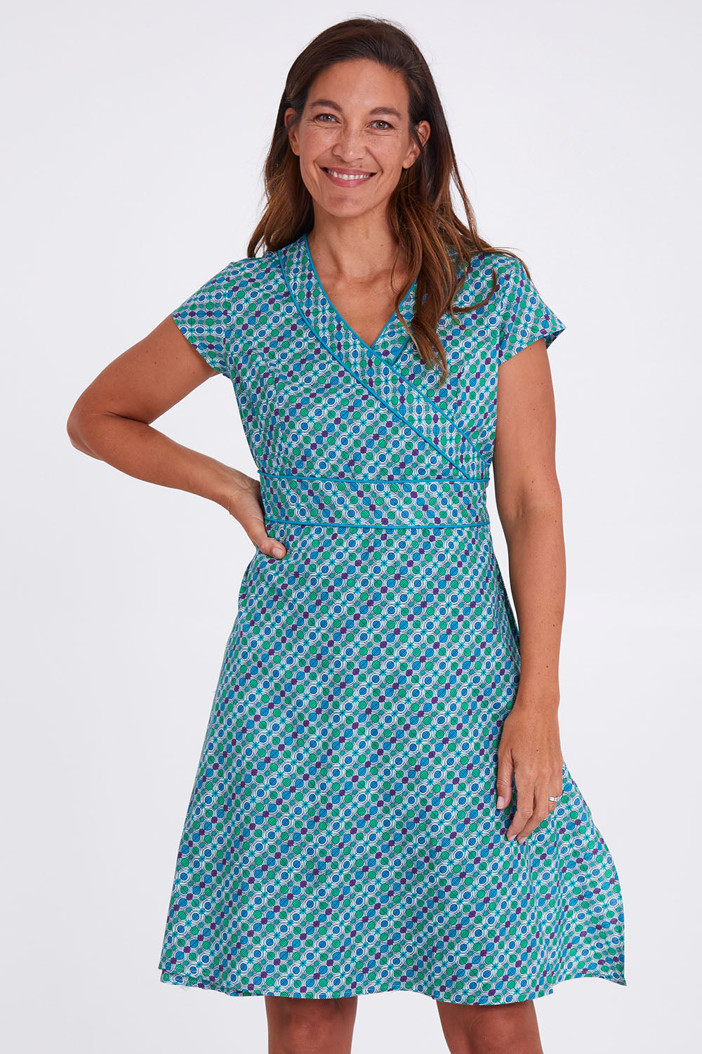 Model Alex wearing size S of the Astrid Dress in colour Emmaprint (Blue), from the front, cropped image