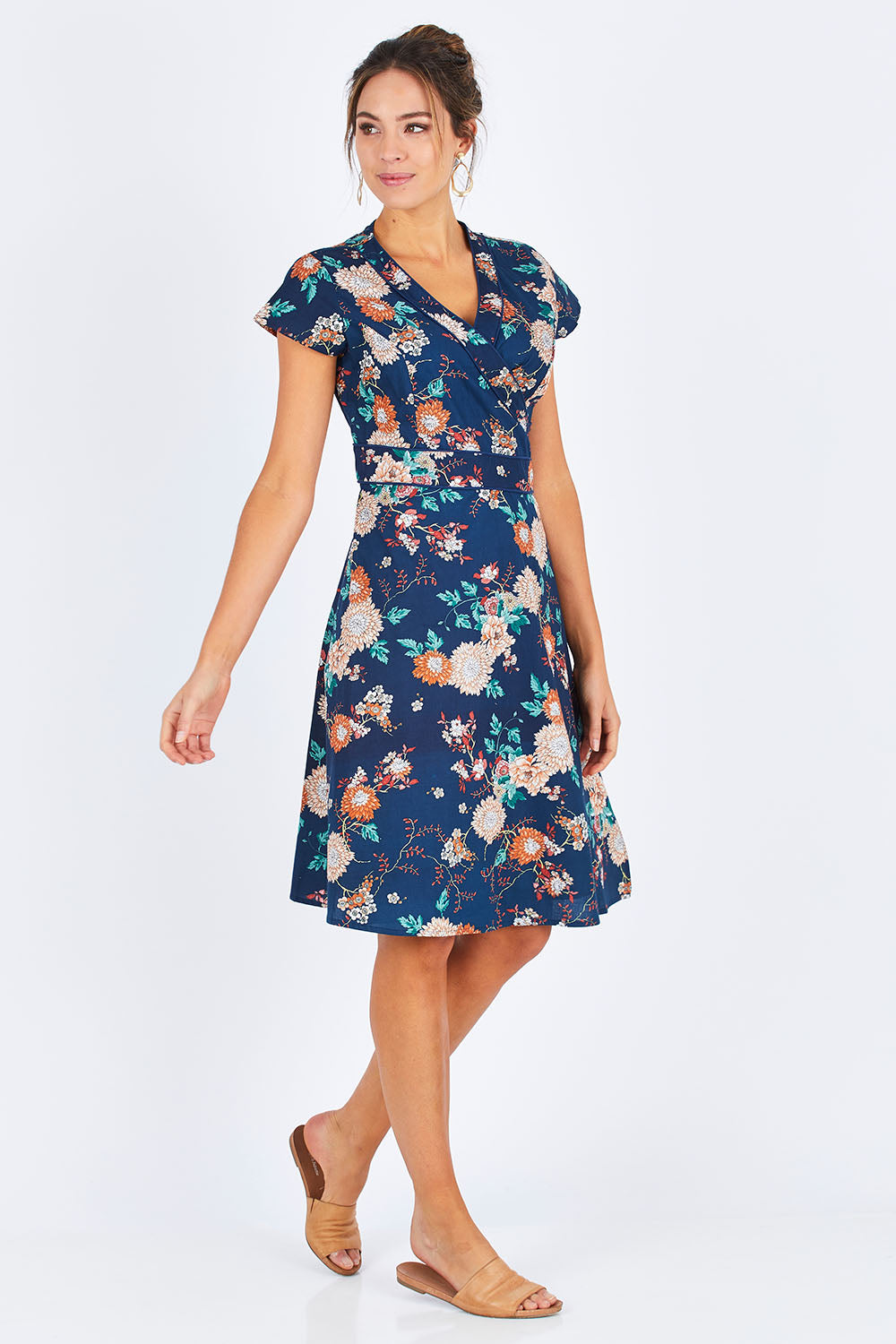 Model Madeline wearing size S of the Astrid Dress in colour Maya (Blue), from the front, showing the whole outfit