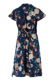 Product shot of the Astrid Dress in colour Maya (Blue), from the back