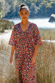 A model wearing the Gypsy Dress in colour Honshu (Black), from the front, showing the whole outfit