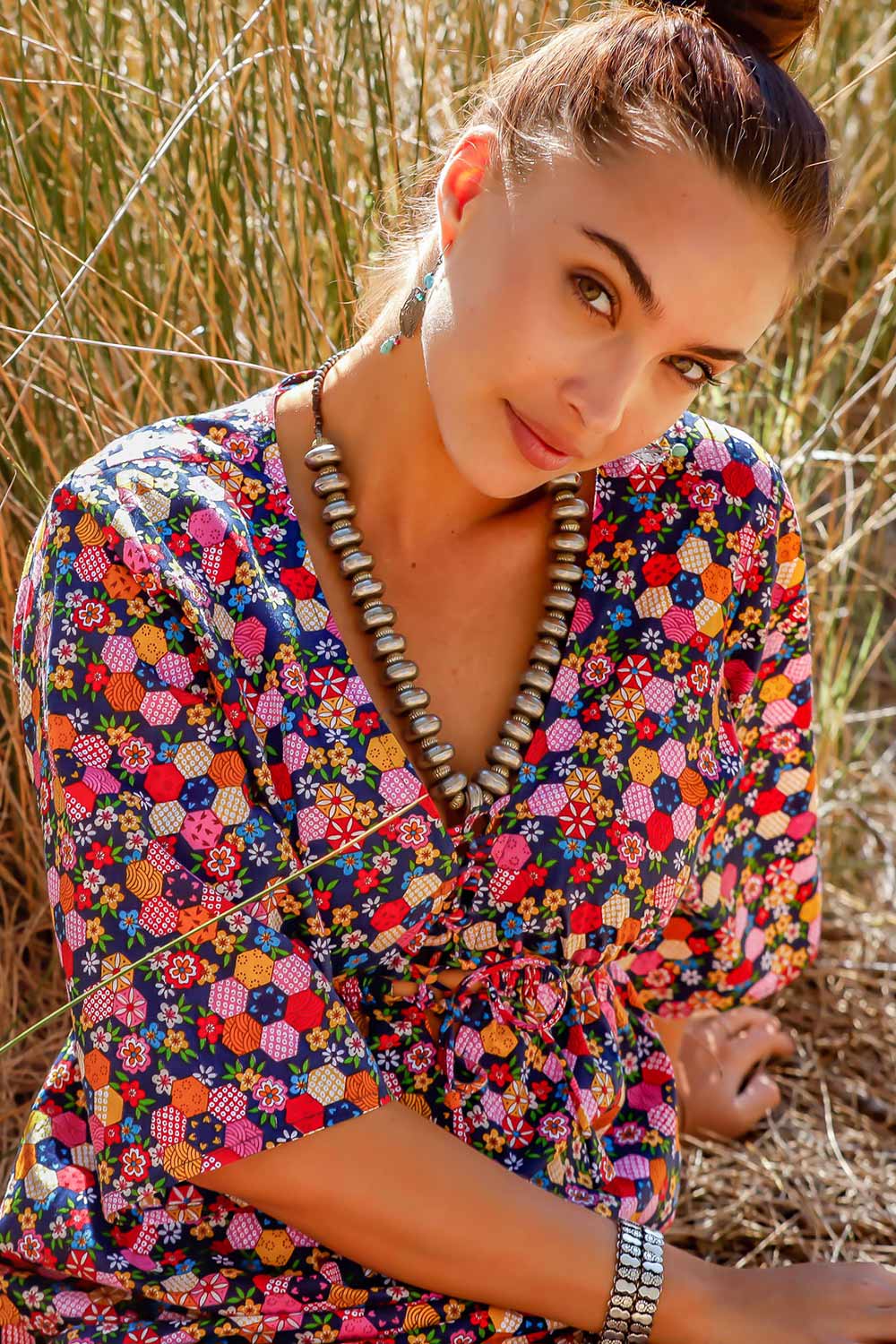 A model wearing the Gypsy Dress in colour Honshu (Black), from the front, showing the whole outfit