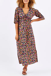 Model Summer wearing size S-M of the Gypsy Dress in colour Honshu (Black), from the front, cropped image