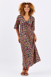 Model Summer wearing size S-M of the Gypsy Dress in colour Honshu (Black), from the front, showing the whole outfit