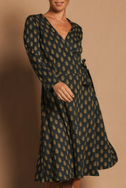 Model Katie wearing size S of the Sunburst Cotton Wrap Dress in colour Acton (Black), from the front, cropped image