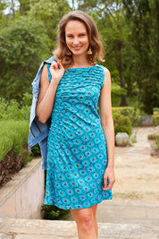 Model Alex wearing size S of the Camden Tunic in colour Stamp (Blue), from the front, showing the whole outfit