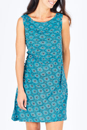 Model Gemma wearing size S of the Camden Tunic in colour Stamp (Blue), from the front, cropped image