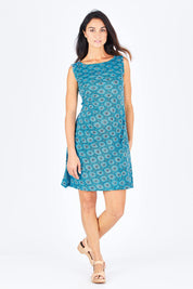 Model Gemma wearing size S of the Camden Tunic in colour Stamp (Blue), from the front, showing the whole outfit
