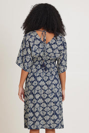 Model Ziara wearing the Evie Dress in colour Yamba, from the back