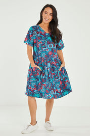 Model Katie wearing size M of the Billie Dress in colour Tinaprint (Blue), from the front, showing the whole outfit