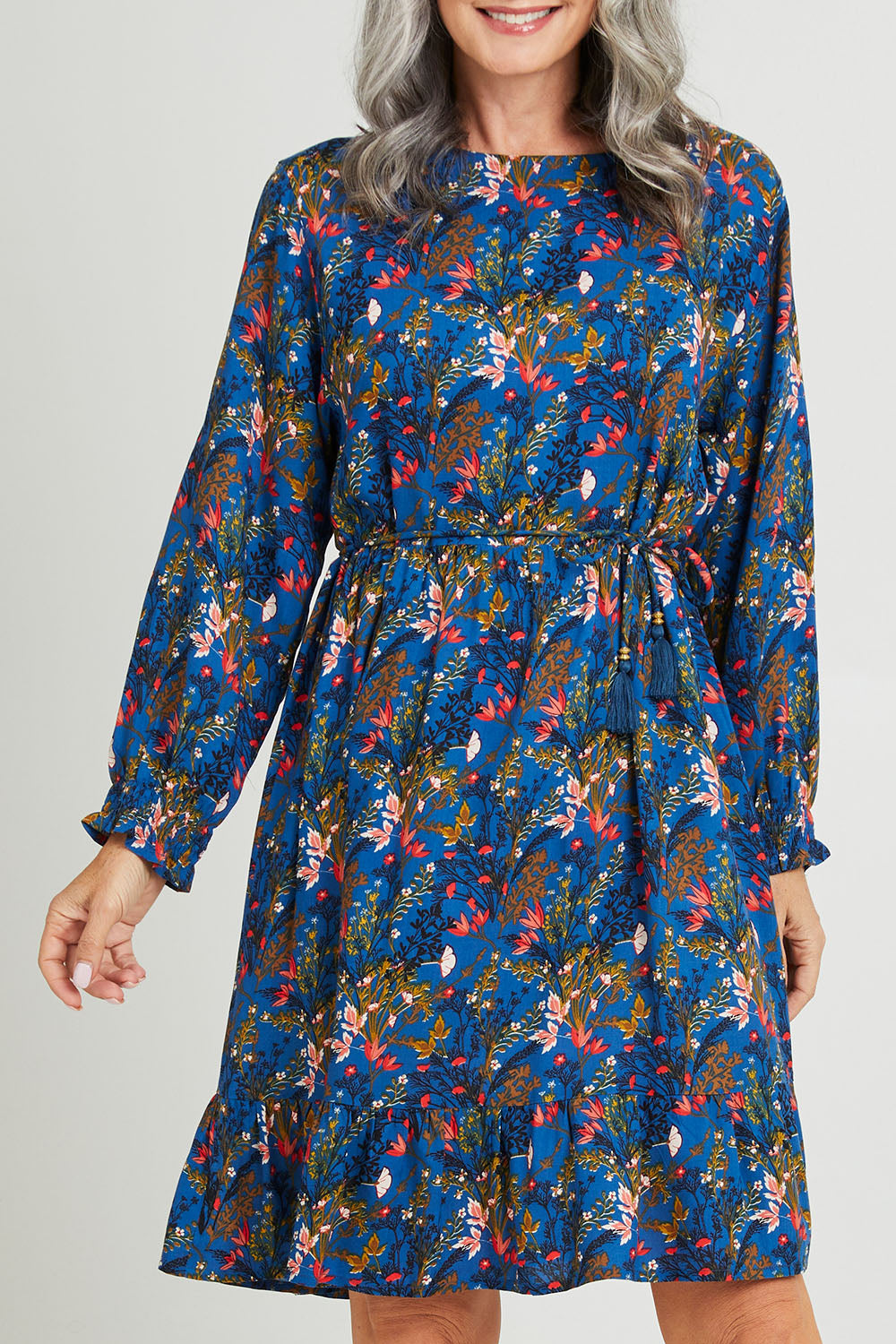 Model Luisa wearing size S of the Rome Dress in colour Corsica (Blue), from the front, cropped image