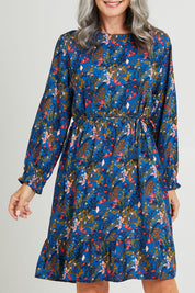 Model Luisa wearing size S of the Rome Dress in colour Corsica (Blue), from the front, cropped image