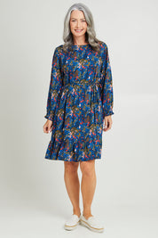 Model Luisa wearing size S of the Rome Dress in colour Corsica (Blue), from the front, showing the whole outfit