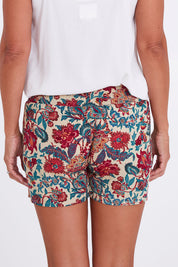 Model Alex wearing the Pip Shorts in colour Remyprint (Red), from the back