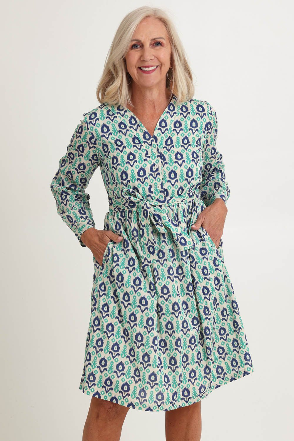 Model Sandy wearing size S of the Heidi Dress in colour Ikata, from the front, cropped image