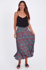Model Alex wearing the Gigi Maxi Skirt in colour Miamiprint (Green), from the front, showing the whole outfit