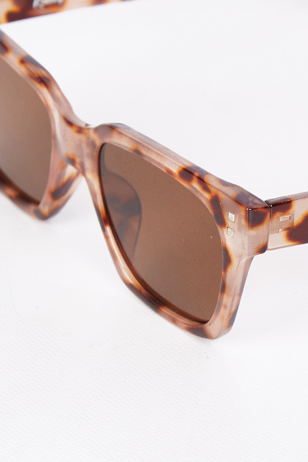 A model wearing size OneSize of the Anvil Square Sunglasses in colour Blossom, from the front, showing the whole outfit